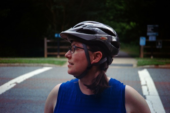 The spousal unit wearing bike helmet, looking to the side