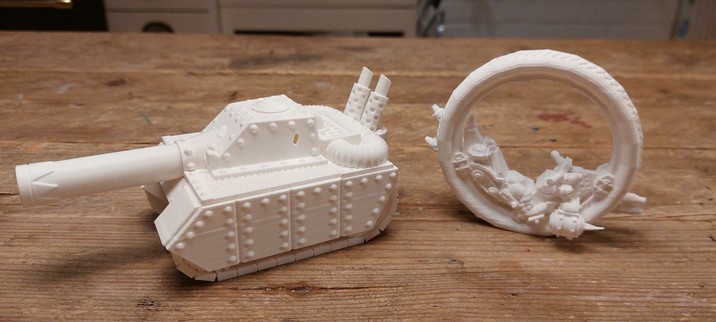 A monowheel with a gun and half an ork and a tank with a big gun lol