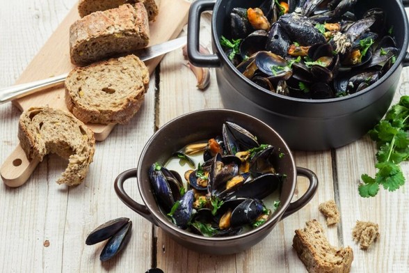 A delicious steaming bowl of moules marinières served at one of the best French restaurants in London