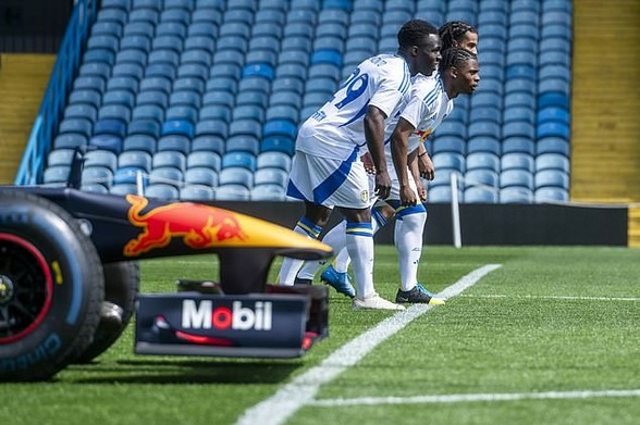 Three Leeds United players raced a Red Bull Formula One car on the Elland Road turf