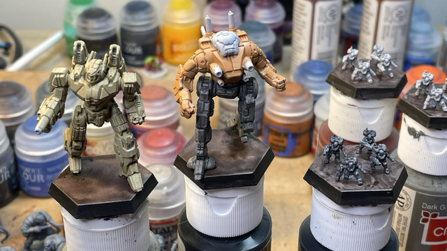 Phoenix Hawk painted tan, Ostsol painted orange and grey, IS battle armor painted grey