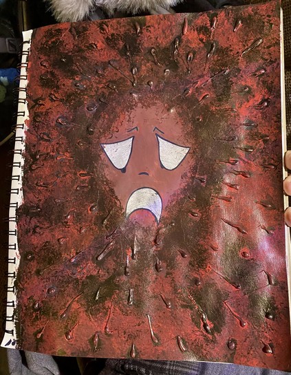 An artistic illustration depicting a sad character with a distressed expression, surrounded by an abstract, textured background in dark red and black hues. The character has white eyes and a frowning mouth, conveying a strong emotional theme.