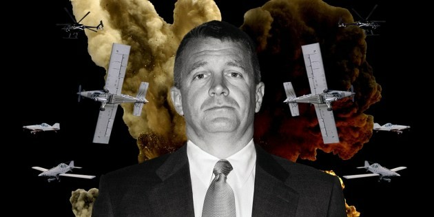 An image of a man wearing a suit and tie, with planes and bombs behind him.