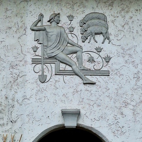 Picture of another stylized bas-relief, this one with a man guarding sheep.