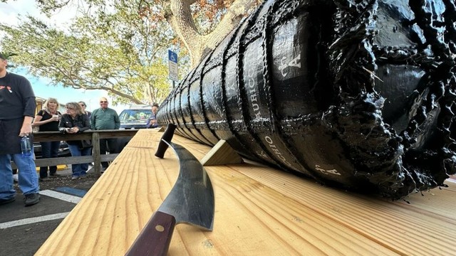 Mazzaro's in St. Pete cuts 916 pound cheese wheel
