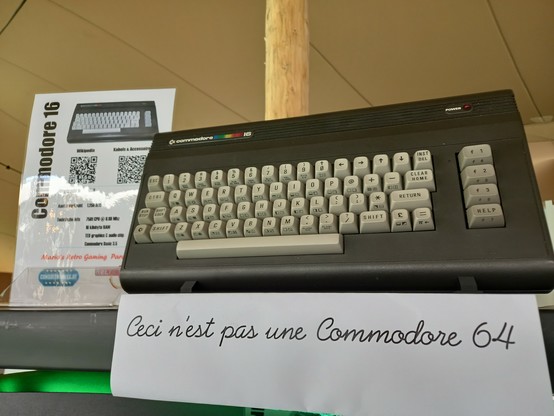 Commodore 16 with an info sheet indicating that it is not a Commodore 64.