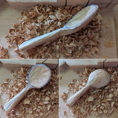 Three views of a partially carved cherry wood spoon resting on a pile of wood shavings on a wooden bench hook. The bowl needs more excavation but the handle is coming in nicely.