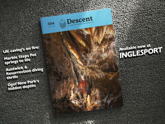 The cover of Descent magazine, issue 304, dated June/July 2025, presented on a textured grey fabric background. The cover showcases a striking photograph of a limestone cave with golden-brown stalactites hanging from the ceiling and rugged rock formations. A caver, dressed in an orange jacket, helmet, and muddy boots, stands within the cave, leaning against a rock face. To the left of the image, white text highlights UK caving topics: "Marble Steps Pot springs to life," "Austwick & Resurrection diving thrills," and "Ogof New Park’s hidden depths." In the top left corner, the magazine’s title appears in bold white lettering on a light blue banner, accompanied by a mountain icon and the tagline "The magazine of underground exploration." The bottom right corner displays pricing details (£7.75 / $9.75) and promotes availability at "INGLESPORT" in large white letters. The overall design conveys an adventurous, exploratory theme.