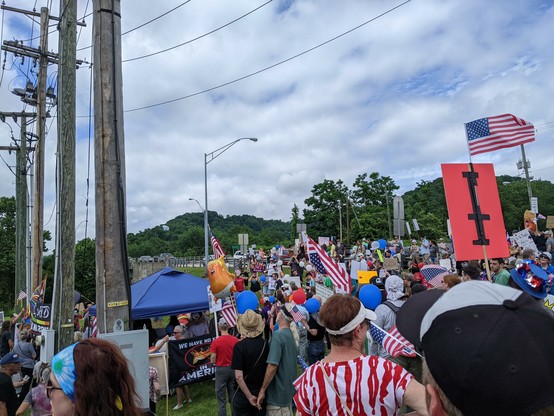 Beginning of the local march with lots of folks with signs & flags.
