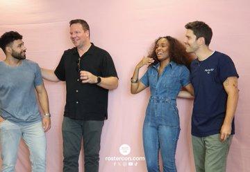 From left to right: Rafael Silva, Jim Parrack, Sierra McClain and Ronan Rubinstein together on stage at a convention, smiling and having fun.