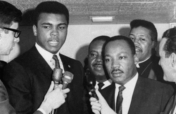 Muhammad Ali, the former Cassius Clay, was convicted by a U.S. federal court in Houston on 20 June 1967. He is shown when refusing induction at the Houston draft board, 28 April 1967. At his right is the Rev. Martin Luther King, Jr.