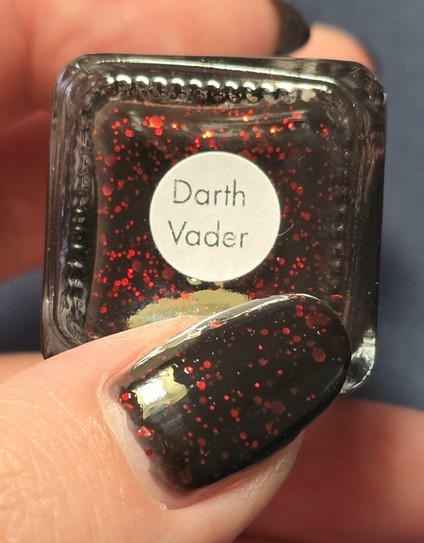 My thumb on the label of the nail polish bottle