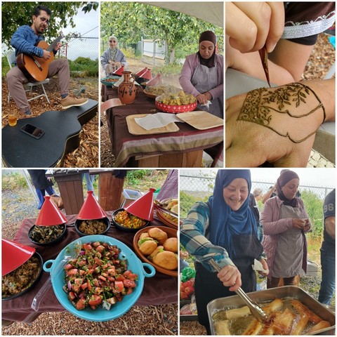A 5 panel collage predominantly composed of medium shots.

Panel 1: Man with glasses and blue shirt sits playing guitar, drink on his guitar case, and foliage in the background.

Panel 2: Two women with hijabs at a table with traditional food and pottery.

Panel 3: Hand applying henna to another hand

Panel 4: Side view table with traditional dishes in red and blue serving dishes.

Panel 5: Woman in hijab smiles, cooking oily food in a pan, a crowd is on the right.