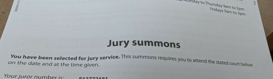 Jury summons letter with all personnel details obscured.