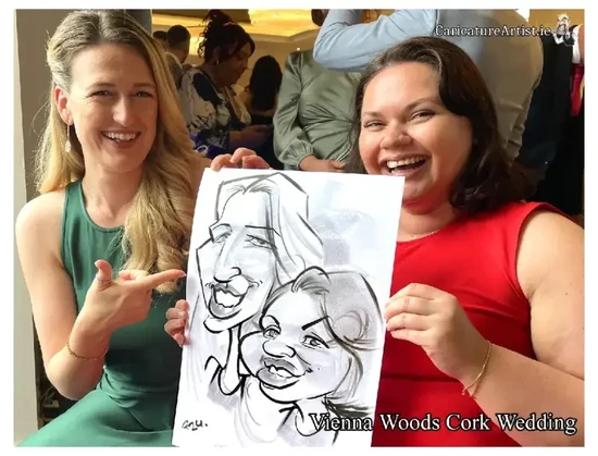Vienna woods wedding entertainment packages two wedding guests laughing holding a caricature of themselves