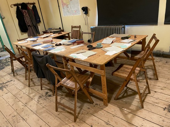 Photo of some of the tables making up an exhibited workplace in Hut 3.