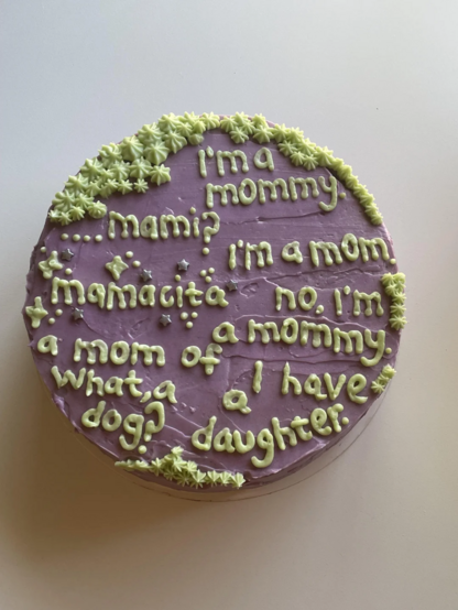 A cake with an iconic quote from Love Island USA written in icing on it.
"I'm a mommy"
"....mami?"
"I'm a mom."
"mamacita"
"no, I'm a mommy."
"a mom of what, a dog?"
"I have a daughter."