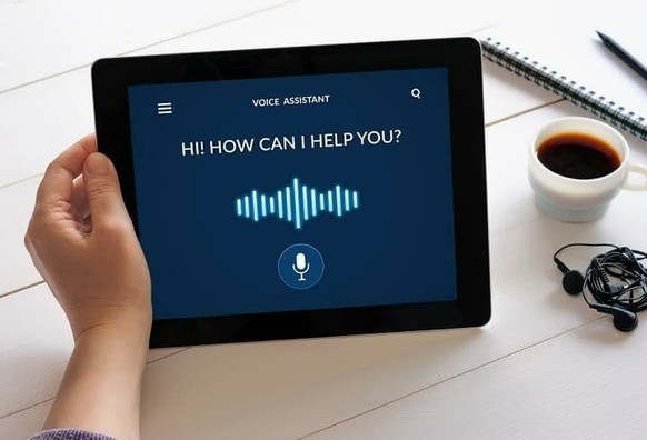 Tablet showing a voice assistant asking how it can help.