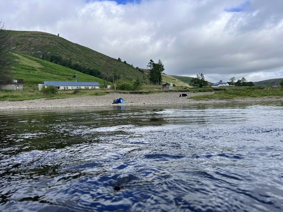 And the same beach from the water with a rucksack and a dog in view as well as the cafe which was not open this morning