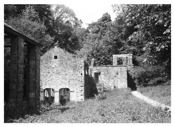Black and white film photograph showing the remains of a 19th century bobbin mill in the north of England.