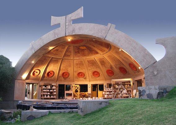 An open half-dome used as a public space while living with nature
