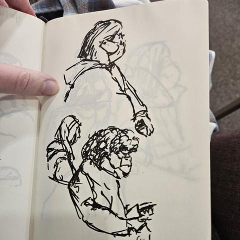 Loose gesture drawings with a brush pen of various people wearing baggy blue masks in a doctors office waiting room.