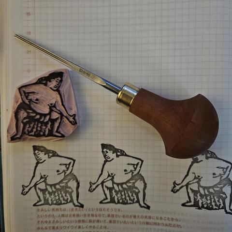 A small pink linoleum stamp of the yokozuna, Onosato, stomping out the evil. Image shows the iterations of cleaning up the line work especially around the face