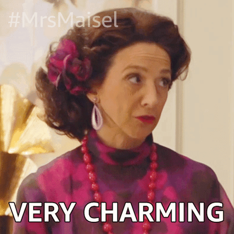 Photo from a gif because I can´t get the gif into this, with a scene from Mrs Mabel with a woman looking a litttle aside with text "VERY CHARMING" underneath