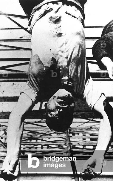 body of Mussolini hung by the feet upside down
