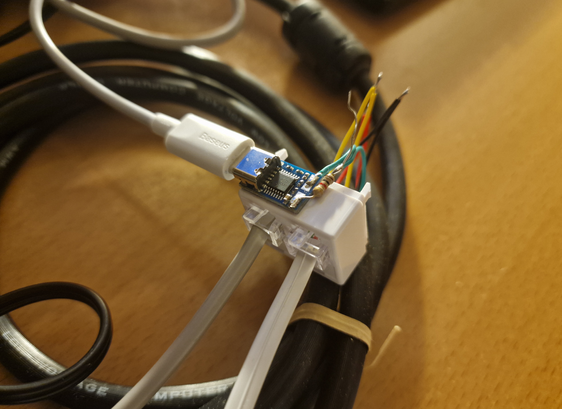 Two phone plugs and a USB-C 20V trigger board glued together and wired to each other.