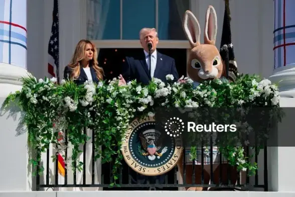 Melania, Trump and some guy in a Easter Bunny suit during White House Easter celebrations of 2026. WTF!
