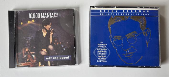 Two used compact discs: 10,000 Maniacs: MTV Unplugged, and a 3-disc set of Benny Goodman: The Birth of Swing 1935-1936