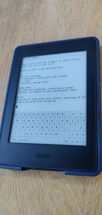 a jailbroken kindle, showing a running text adventure