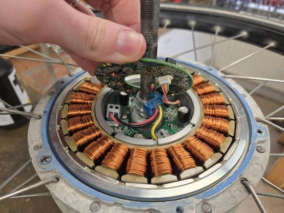 Lifted the top board inside the hub to show the motor drive electronics on a board below