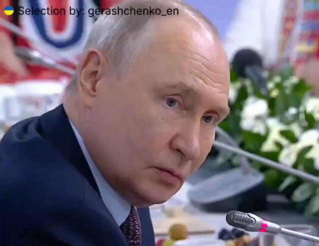 Putin making a childish grimasse, closing his eyes and sticking his tongue out.