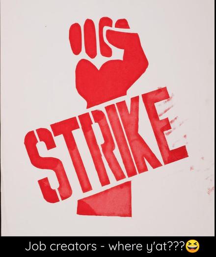 The word "STRIKE" in all caps in a stencil-like font written across the arm of a raised fist.