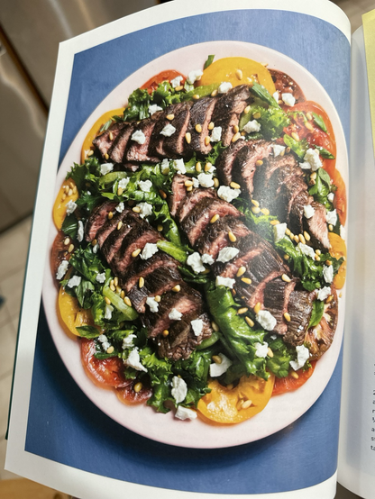 A cookbook photo of a steak salad