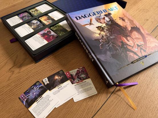 The core rulebook and the core card set for the Daggerheart roleplaying game