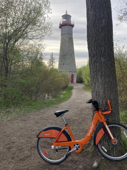 A Bike Share TO bike in front of an 1808 lighthouse.