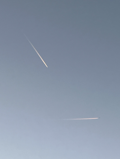 Two airplanes in the blue evening sky over Wolfenbüttel/Germany