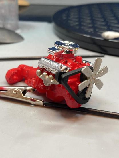 A little International Harvester V8 engine connected to a transmission and transfer case.