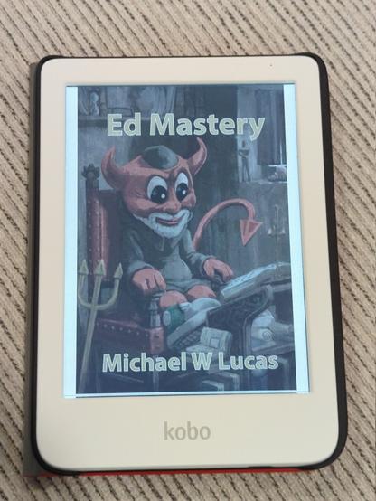The cover page to Ed Mastery by Matt W. Lucas on a Kobo color device. The cover shows what looks to be a scholarly BSD Daemon with a gray beard and some kind of cap, sitting on a red velvet chair with books/manuscripts in front of him.