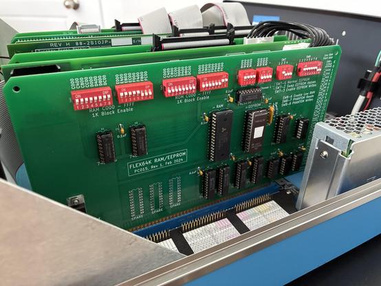 An S-100 card installed in an Altair 8800. Across the top are many DIP switches.
