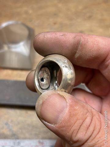 Looking into the dome of the ring, there's a large bubble of silver filling most of the hollow