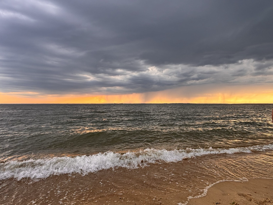 Dramatic clouds over the bay as storms roll through at sunset