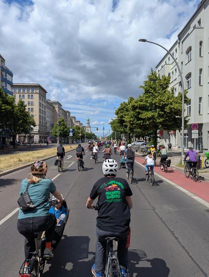 Karl Marx Allee going towards Alexanderplatz/ TV tower, sunny, bicycles