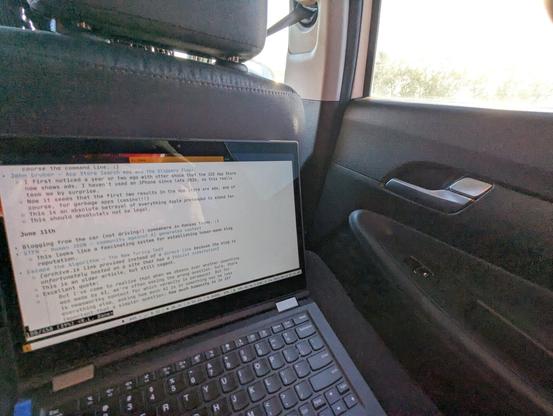 My Thinkpad X390 Yoga on my lap in the back seat of a car
