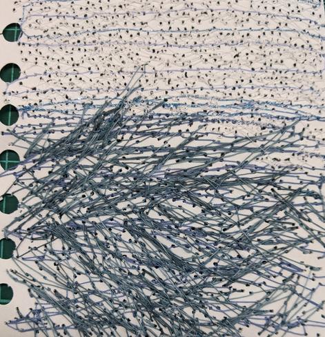 Textural stitches, heavily layered on the paper, blues, greys and white. Abstract, but a bit like wild seas and sky above.