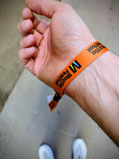 Doug's arm with a MozFest wristband