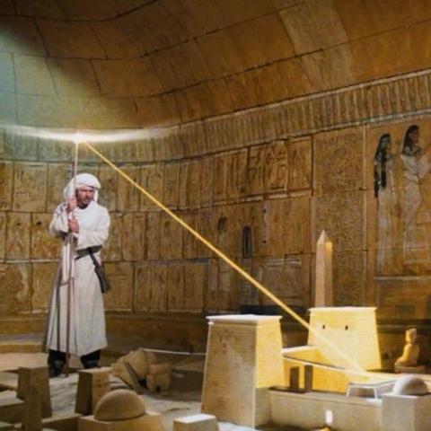 Indiana Jones directs a beam of solstice light onto a map on a floor in a tomb. Note: not my photo.